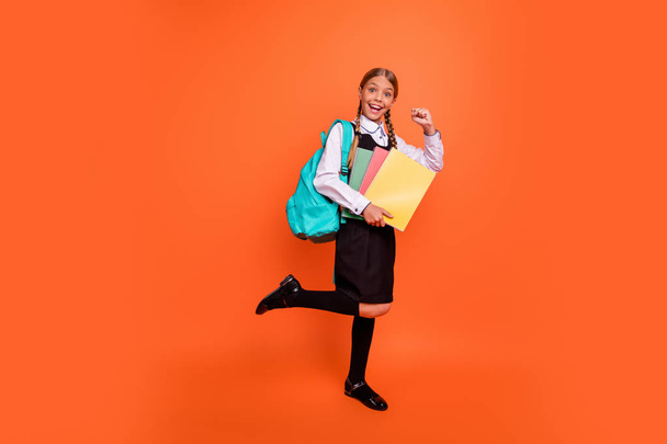 Full length body size view of her she nice attractive lovely charming cheerful cheery girlish confident pre-teen girl best course class learner isolated over bright vivid shine orange background - 写真・画像