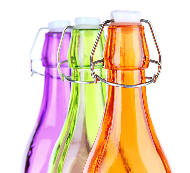 Colorful bottles isolated on white - 写真・画像