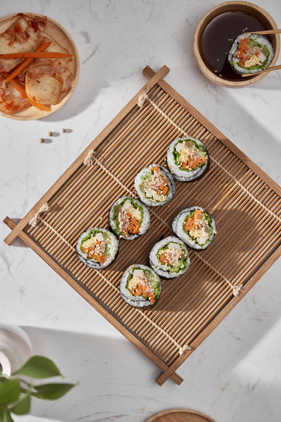 Korean roll Gimbap(kimbob) made from steamed white rice (bap) and various other ingredients - Photo, Image