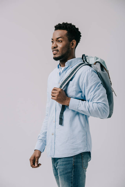 curly african american man standing with backpack isolated on grey  - Φωτογραφία, εικόνα