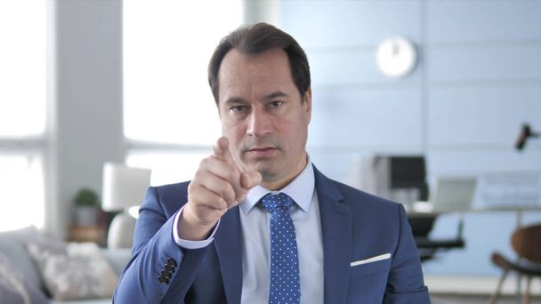 Middle Aged Businessman Pointing with Finger - Photo, Image