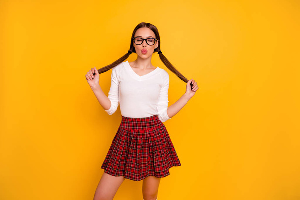 Portrait of charming attractive lady youth people touch hairdo haircut close eyes eyewear eyeglasses smart person want date send air kisses isolated modern clothing yellow background - Photo, Image