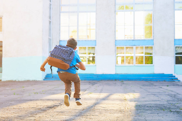 happy little boy, high jumped with joy, the beginning of the sch - Fotografie, Obrázek