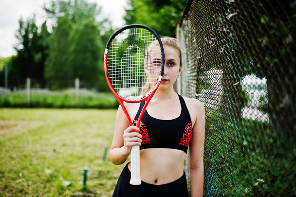 Beautiful sport woman tennis player with racket in sportswear co - Foto, imagen