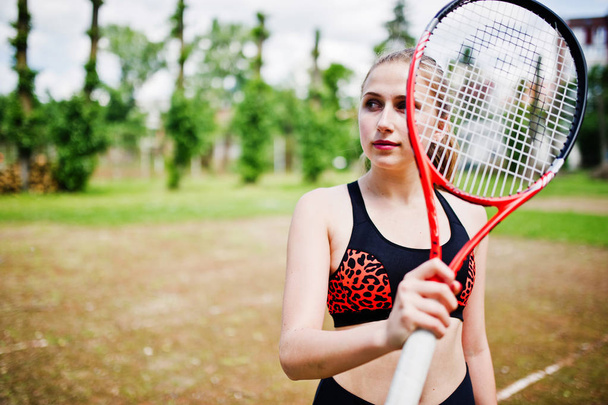 Beautiful sport woman tennis player with racket in sportswear co - Фото, изображение