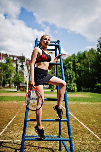 Beautiful sport woman tennis player with racket in sportswear co - Foto, Imagen