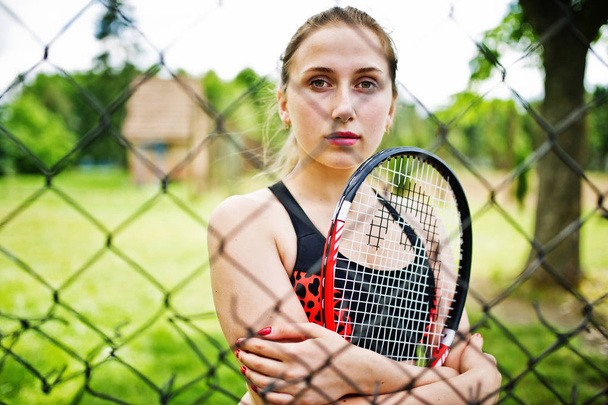 Beautiful sport woman tennis player with racket in sportswear co - Fotoğraf, Görsel