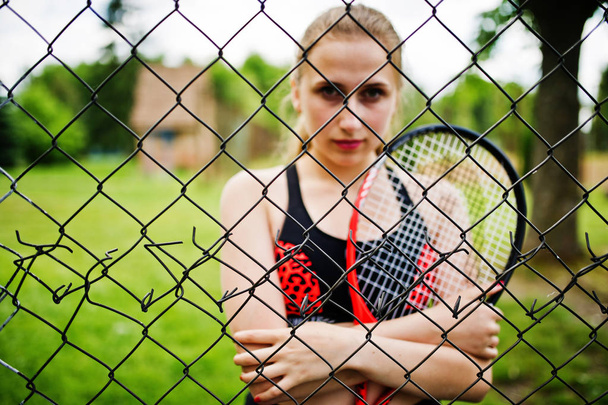 Beautiful sport woman tennis player with racket in sportswear co - Фото, зображення