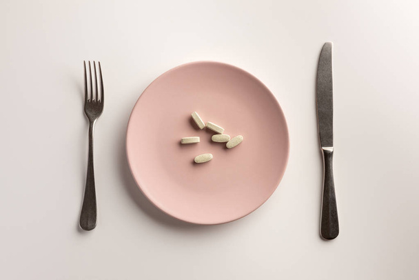 Dietary supplements on the plate. Flat lay. - Foto, imagen