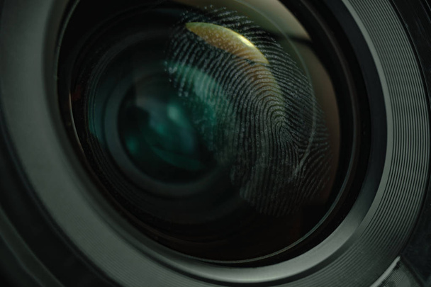Close up fingerprint on a camera lens background. Macro view. - Photo, Image