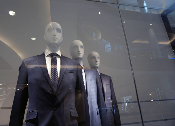 A group of mannequins in strict business suits. - Zdjęcie, obraz