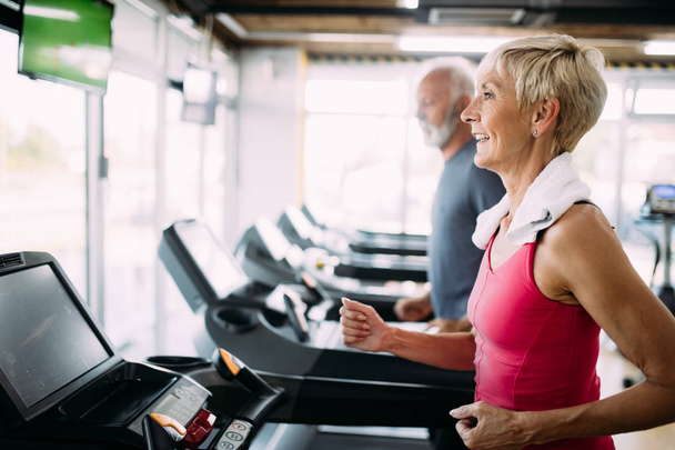 Image of attractive fit mature woman in gym - Photo, Image