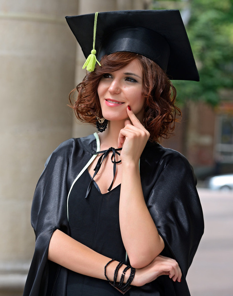 A university graduate in robes - 写真・画像