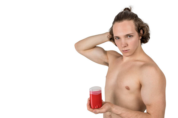 Handsome young man with deodorant on white background isolated - Foto, Bild