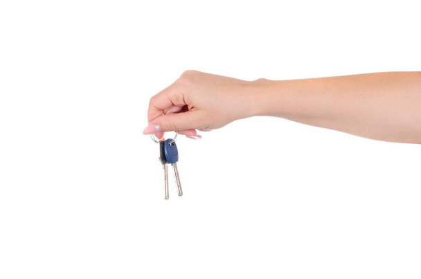 A woman holds the keys to the lock in her palm on a white background. - Фото, изображение