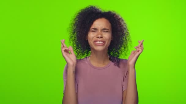 African American woman crosses fingers anticipate hearing good news - 映像、動画