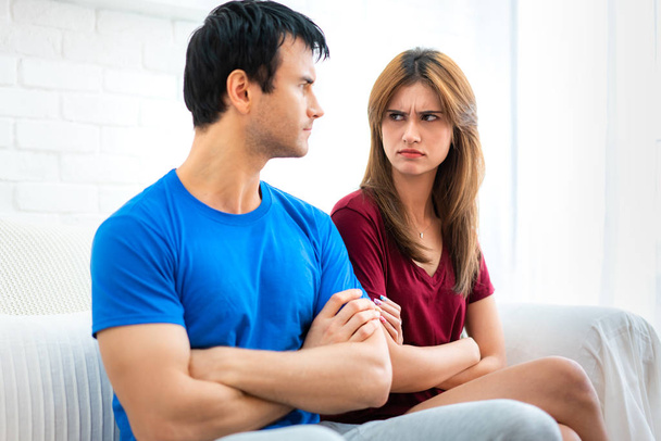 Family couple sitting on the couch not talking after argument, y - Photo, Image