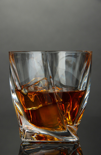Glass of whiskey, on dark background - Fotoğraf, Görsel