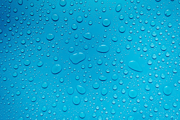 Kapky vody na modrém pozadí, pro design a reklamu - Fotografie, Obrázek