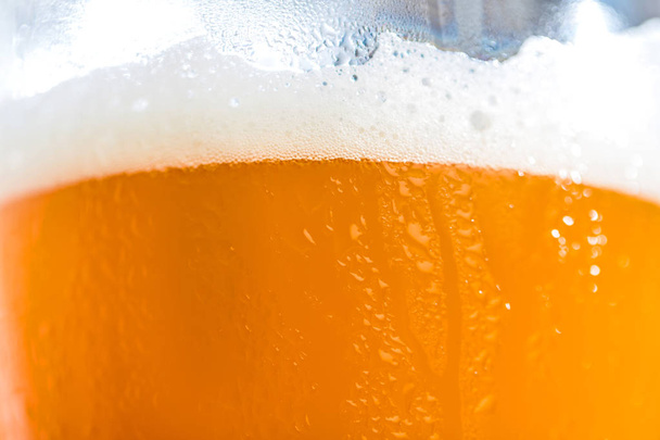 close-up view of glass full of fresh cold beer with foam - Φωτογραφία, εικόνα