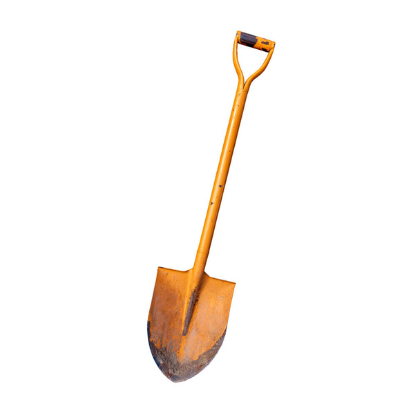Old orange shovel isolated on white background. With clipping path - 写真・画像