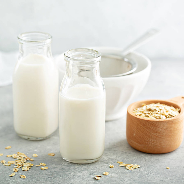 Oat milk in glass bottles - Foto, immagini