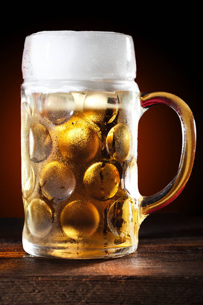 close-up view of glass of beer on wooden background - Φωτογραφία, εικόνα