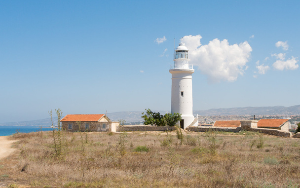 White lighthouse against a blue sky - Zdjęcie, obraz