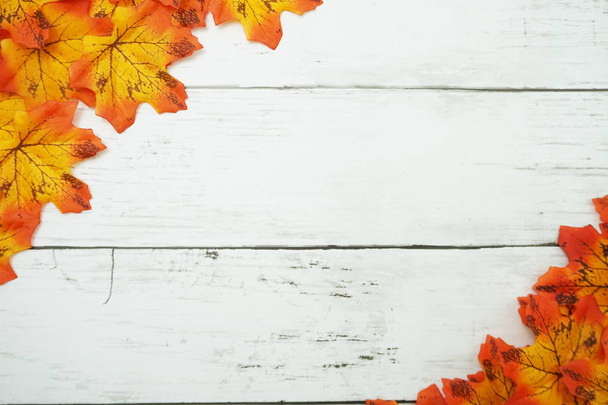 Autumn Maple leave border frame with space copy on wooden background - Photo, Image