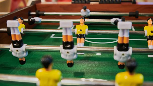 Table football, table football with close-ups of yellow and white players. - Фото, зображення