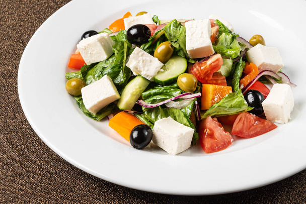 greek salad on the white plate, close up - Photo, Image