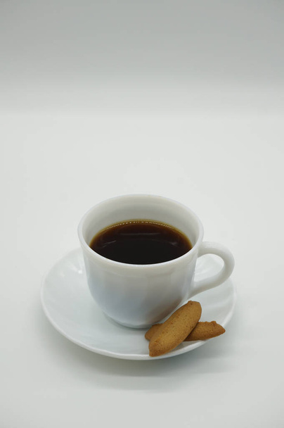 Cup of coffee with biscuits on white background - Foto, Imagem