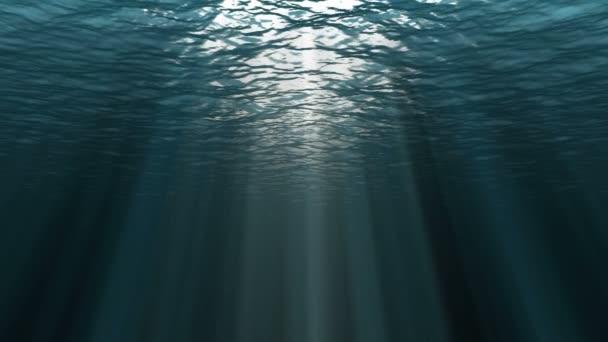 Donkerblauw oceaanoppervlak gezien vanaf onderwater. Abstract Fractale golven onder water en zonnestralen die doorschijnen   - Video