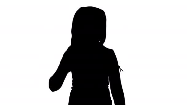 Silhouette Happy cute little youtuber vlogger waving hand saying hello hi looking at camera talking and walking. - Footage, Video