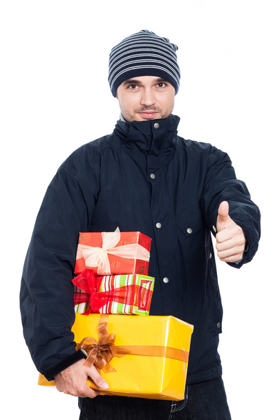 Man with presents thumbs up - Foto, imagen