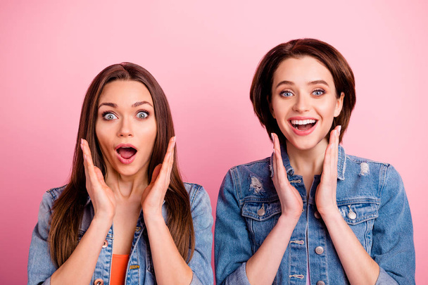Close up photo two sisters beautiful amazing funky she her ladies perfect appearance party chill mood hands arms cheeks lottery wear jeans denim jackets blazers isolated bright pink background - Fotoğraf, Görsel