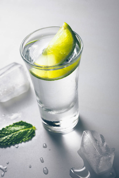 A shot glass of vodka on the table - Foto, Bild
