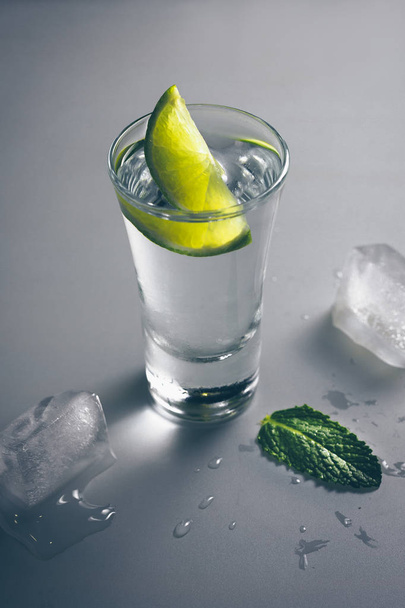 Tequila with lime and mint - Foto, afbeelding
