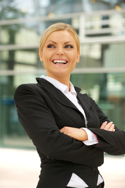 Happy businesswoman smiling in the city - Photo, Image