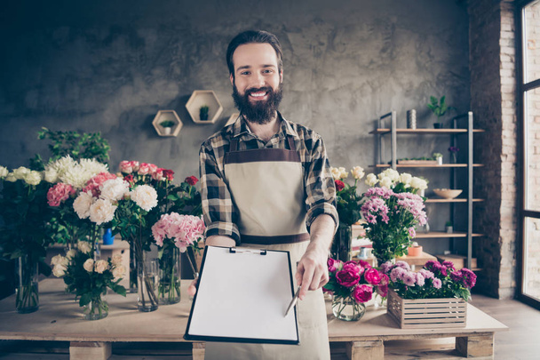 Portrait of positive self-employed person people hold hand want purchase customer botanical botany shop sales person floral indoors feel relax satisfied wall checked shirt - 写真・画像