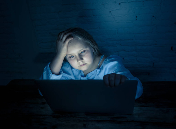 Scared sad girl bullied online on laptop suffering cyber bullying harassment. School girl humiliated on the internet by classmates feeling desperate and intimidated. Children victim of bullying. - Foto, Bild