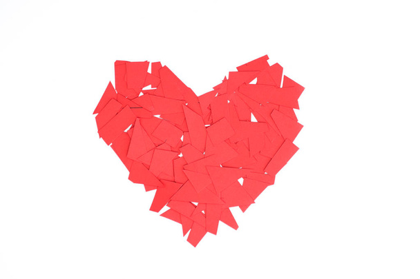 Heart made from pieces of red paper - Foto, Imagen
