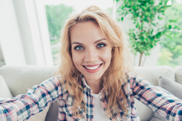 Self-portrait of her she nice-looking attractive lovely lovable sweet cheerful cheery positive wavy-haired girl in checked shirt at white light style interior living-room indoors - Fotografie, Obrázek