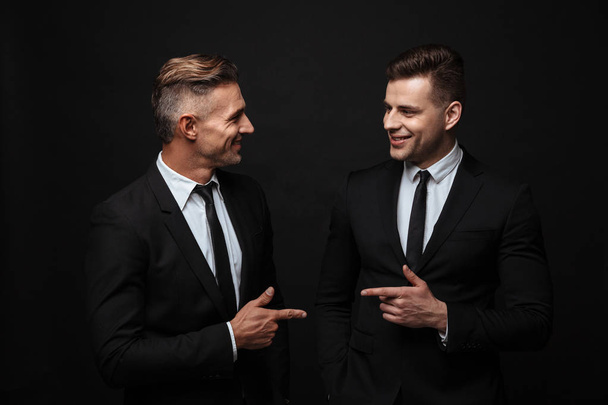 Two confident handsome businessmen wearing suit - Fotoğraf, Görsel