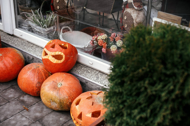 Pumpkins with scary faces in city street, holiday decoration of  - Photo, Image