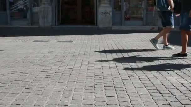 Legs of men and women walking crossing each other in slow motion - Кадри, відео