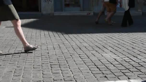 Legs of a woman followed from child and man in slow motion - Video