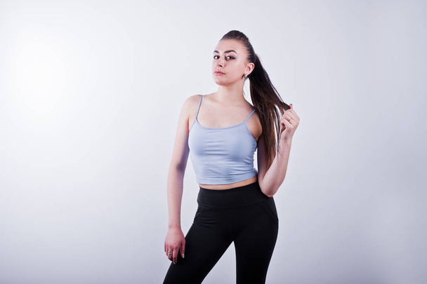 Cheerful attractive young fitness woman in top and black legging - Fotografie, Obrázek