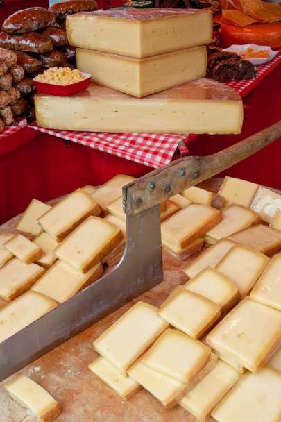 cheese on a cutting board on a market - Photo, Image