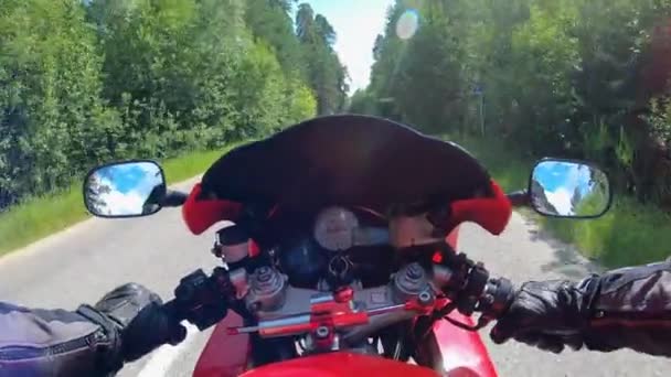Motorbike driving process in a first-person view. Motorcyclist racing his motorcycle. - Footage, Video